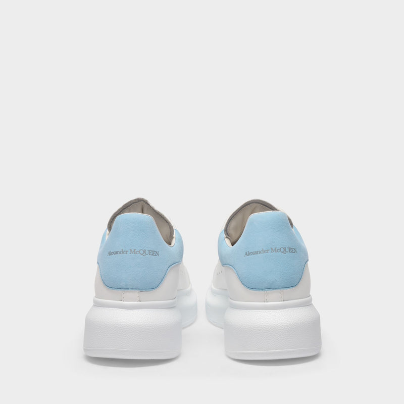 New Season by #AlexanderMcQueen - These white and blue oversized sneakers  have been constructed from supple leather and rubber and feature a flat  heel a… | Schoenen